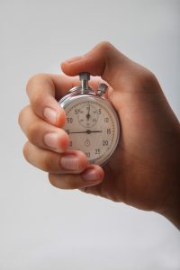 A stop watch representing the time limits for manual handling compensation claims.