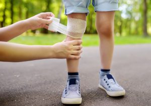 A child has his leg bandaged after being injured in a playground accident.