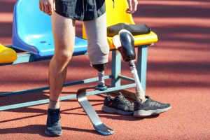 A man is on a racetrack with a prosthetic leg 