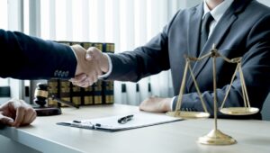 A solicitor agreeing a claim after showing a client how a serious injury compensation calculator can help